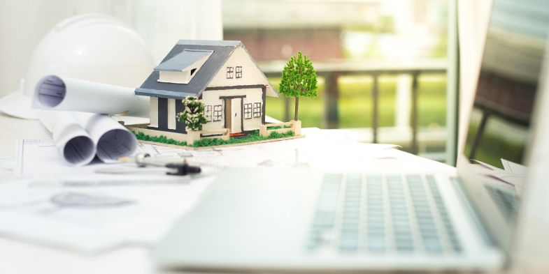 Model house beside computer