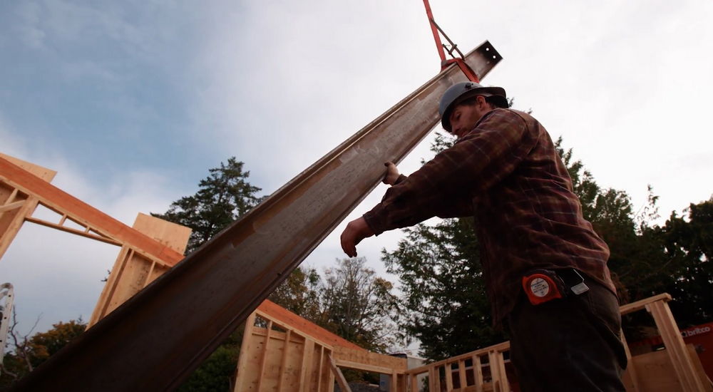 House builder moving I-beam