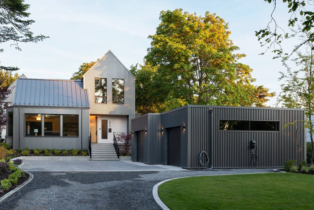 grey home with driveway and garage 