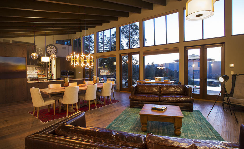 comfortable living room with chandelier and wood