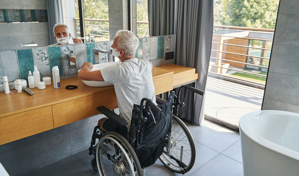 man using bathroom in wheelchair